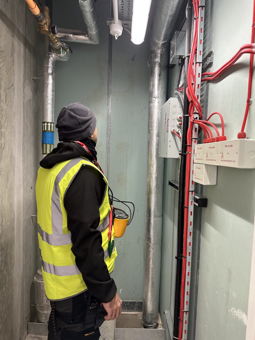 Electro Sure electrician working on-site on a Greater Manchester street
