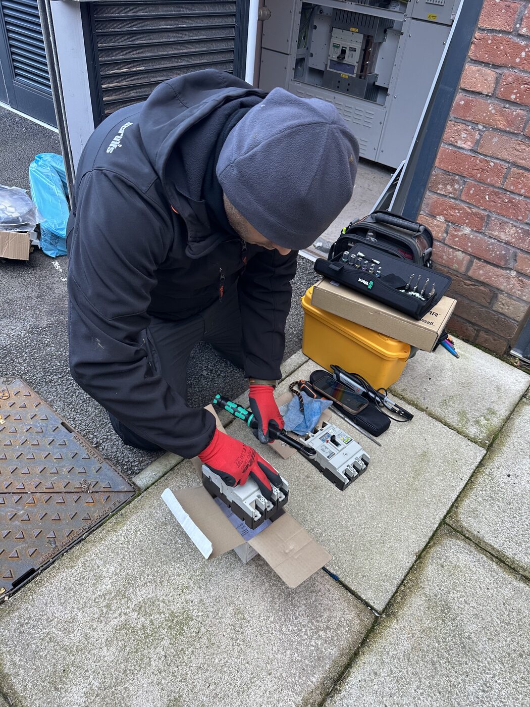 Electro Sure electrician carrying out fire alarm testing in a commercial plant room